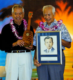 Fred and Sam Kamaka with the induction portrait of their father and pineapple ukulele #1, at Ukulele Expo 2000