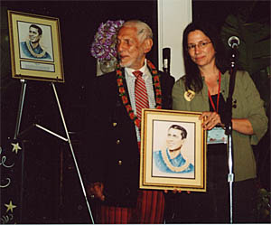 Nuni Walsh of the Ukulele Hall of Fame presents Bill Tapia with his Hall of Fame induction portrait at Ukulele Expo's Uke Fest West, April 2004